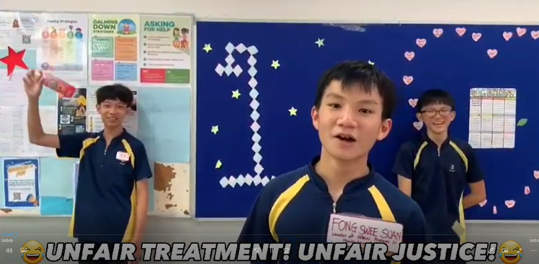 Three school boys in navy uniforms stand in a classroom with text reading Unfair Treatment Unfair Justice at the bottom.